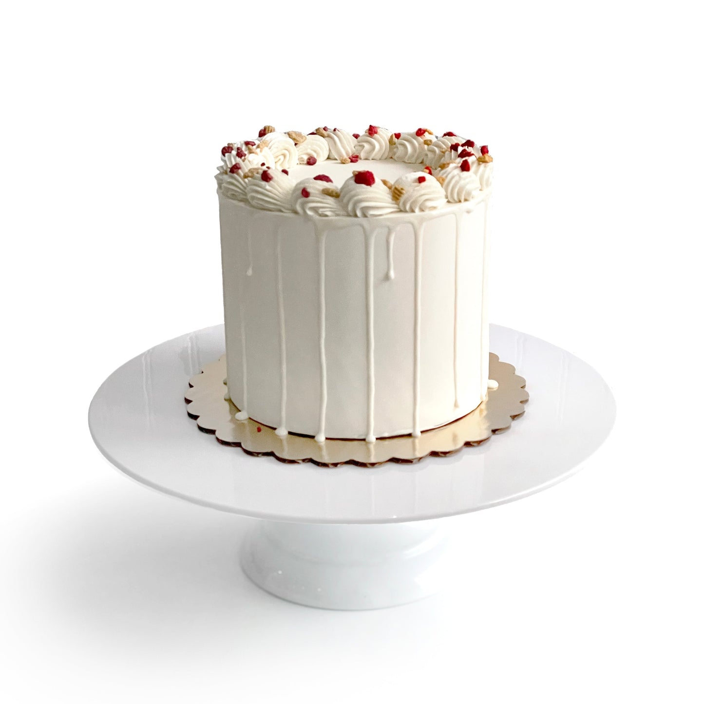 Double Vanilla & Chocolate Cake filled w/Strawberry Preserves, covered in White Chocolate Ganache