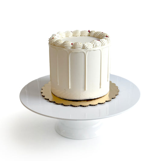 Lemon Cake filled w/ Raspberry Preserves covered w/ White Chocolate Ganache