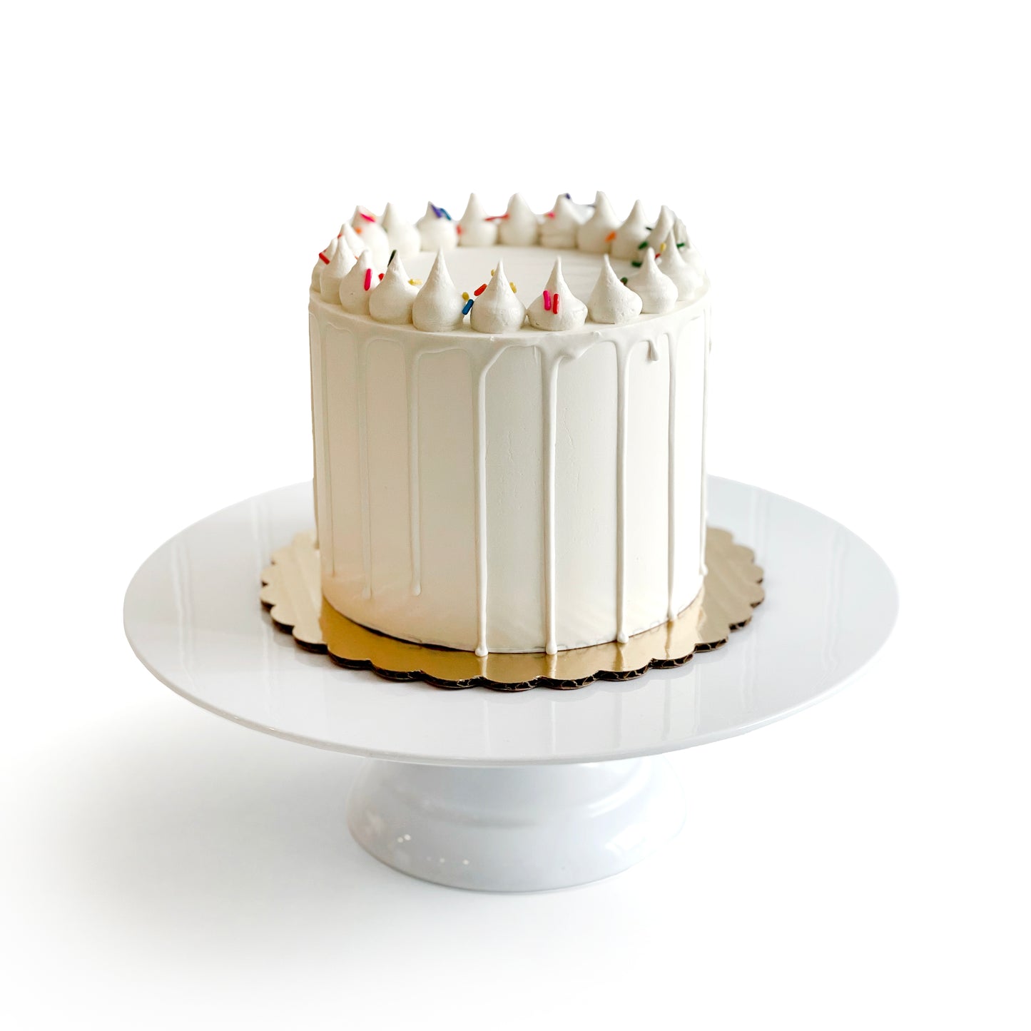 Double Vanilla Cake filled w/ Cream Cheese Buttercream covered w/ White Chocolate Ganache