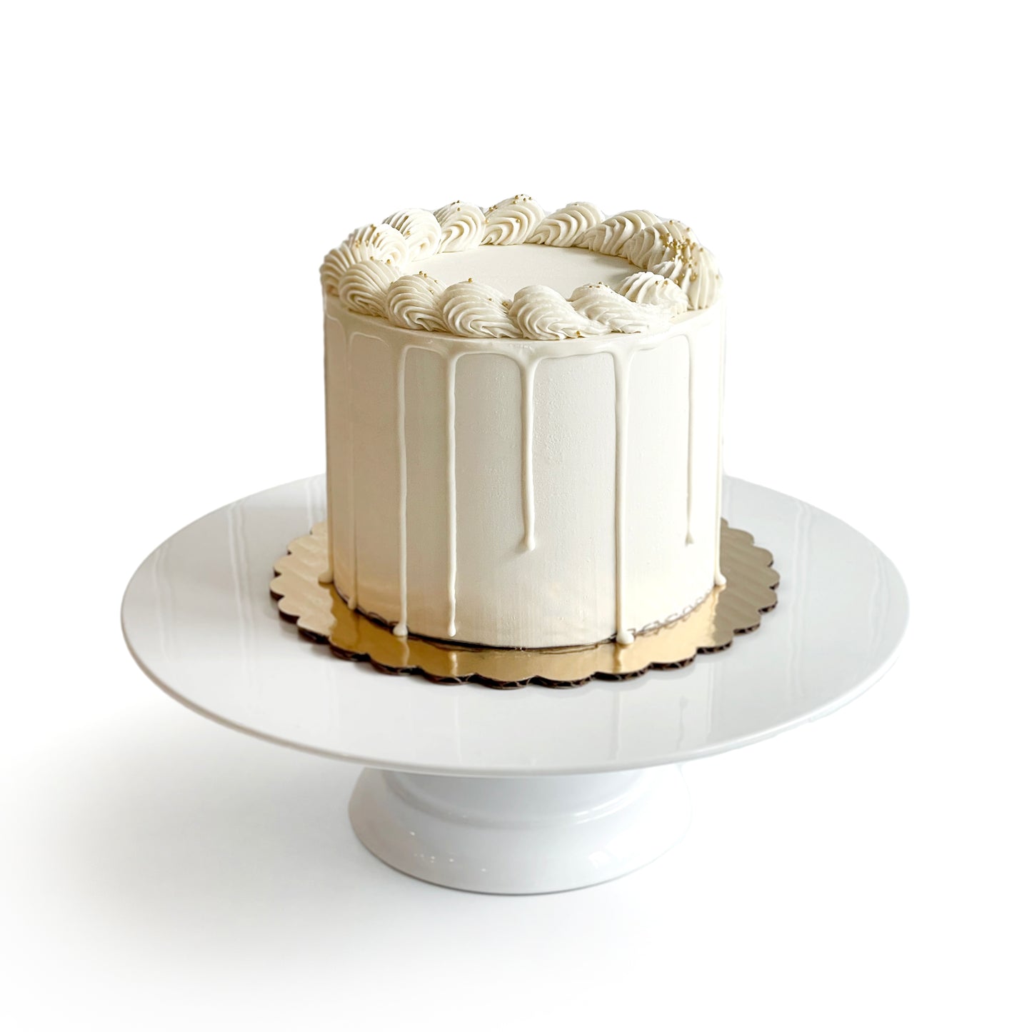 Double Vanilla Cake filled w/ Dulce de Leche covered w/ White Chocolate Ganache