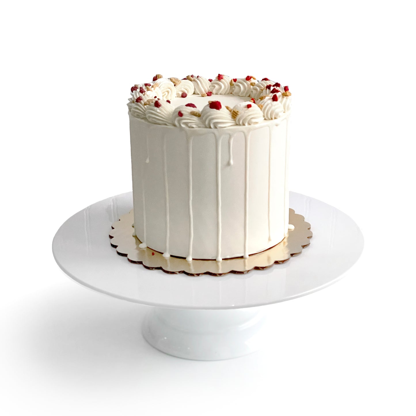 Double Vanilla Cake filled w/ Raspberry Preserves covered w/ White Chocolate Ganache
