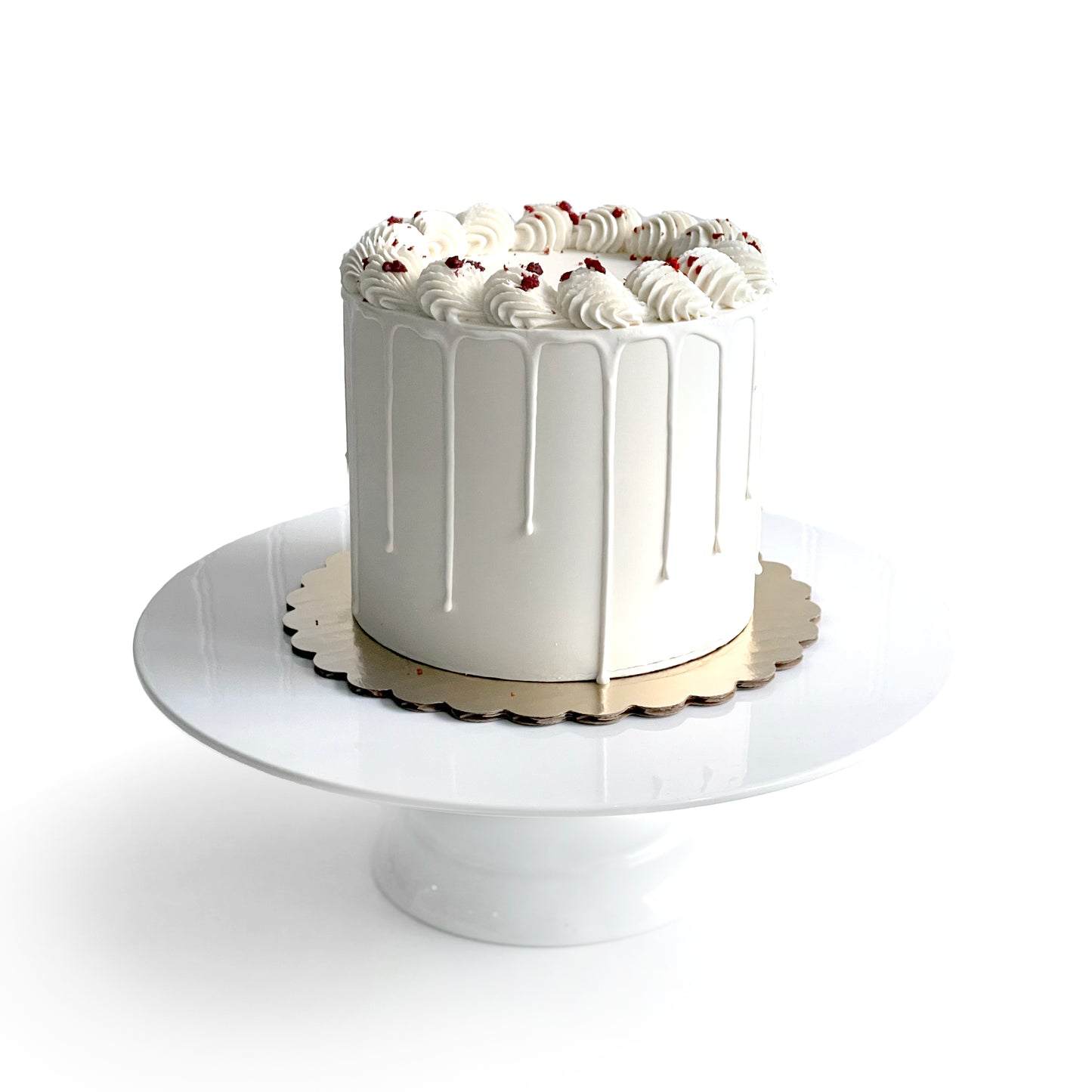 Red Velvet Cake filled w/Cream Cheese Buttercream covered in White Chocolate Ganache