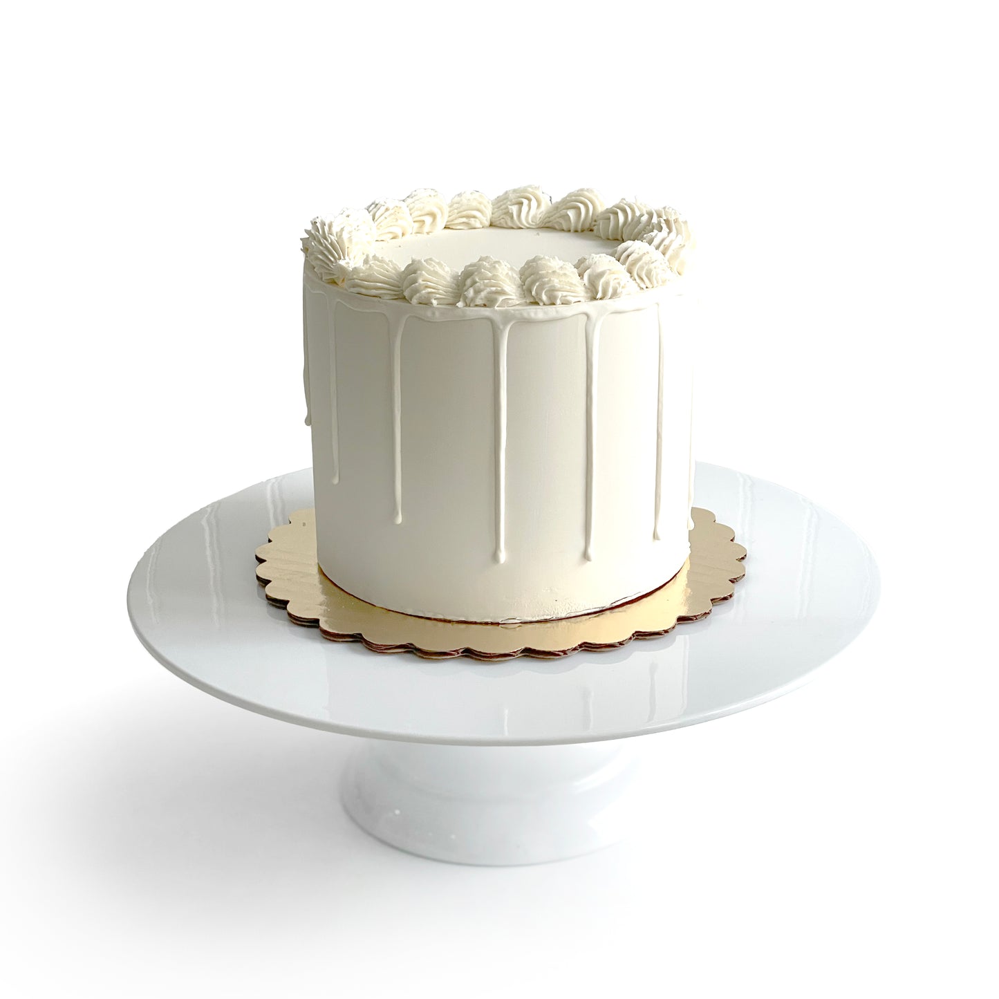 Double Vanilla Cake filled w/ Salted Caramel covered w/ White Chocolate Ganache