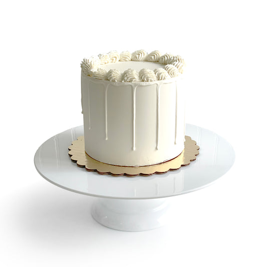 Chocolate and Vanilla Cake filled w/ Salted Caramel covered in White Chocolate Ganache