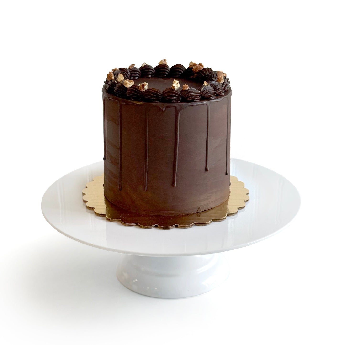 Chocolate Cake filled w/ Chocolate Caramel w/ Candied Pecans/ coveredDark Chocolate Ganache