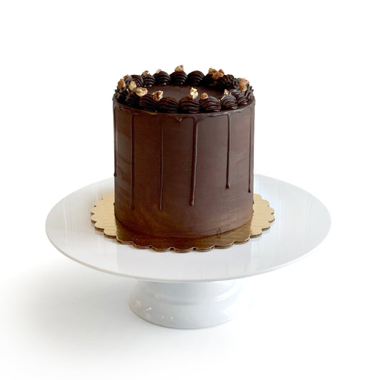 Chocolate Cake filled w/ Chocolate Caramel w/ Candied Pecans/ coveredDark Chocolate Ganache