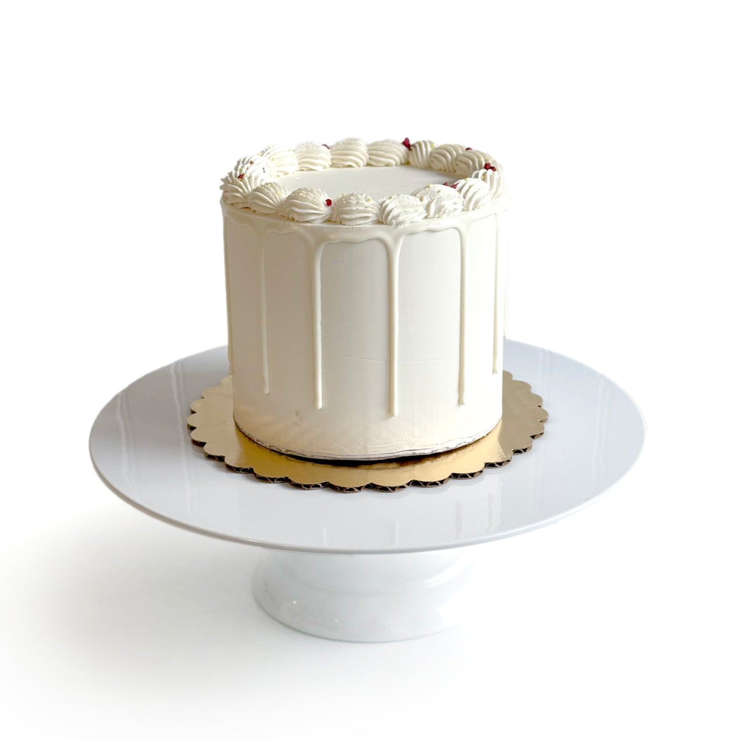 Double Vanilla & Cheese Cake filled w/ Strawberry Cream Cheese Buttercream covered w/ White Chocolate Ganache