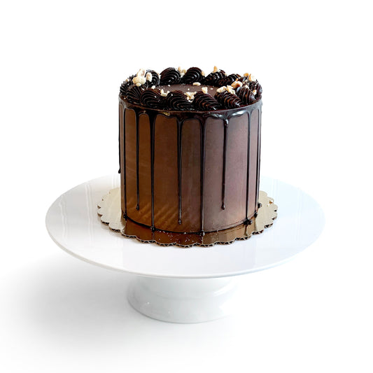 Chocolate Cake filled w/ Chocolate Cream Cheese Buttercream covered in Dark Chocolate Ganache