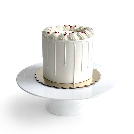 Red Velvet & Cream Cheese Cake filled w/ Cream Cheese Buttercream covered w/ White Chocolate Ganache