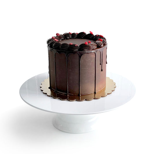 Chocolate Cake filled w/ Strawberry Cream Cheese Buttercream covered w/ Dark Chocolate Ganache