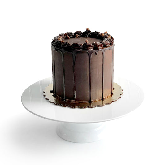 Chocolate Cake filled w/ Chocolate Mousse & covered w/ Dark Chocolate Ganache